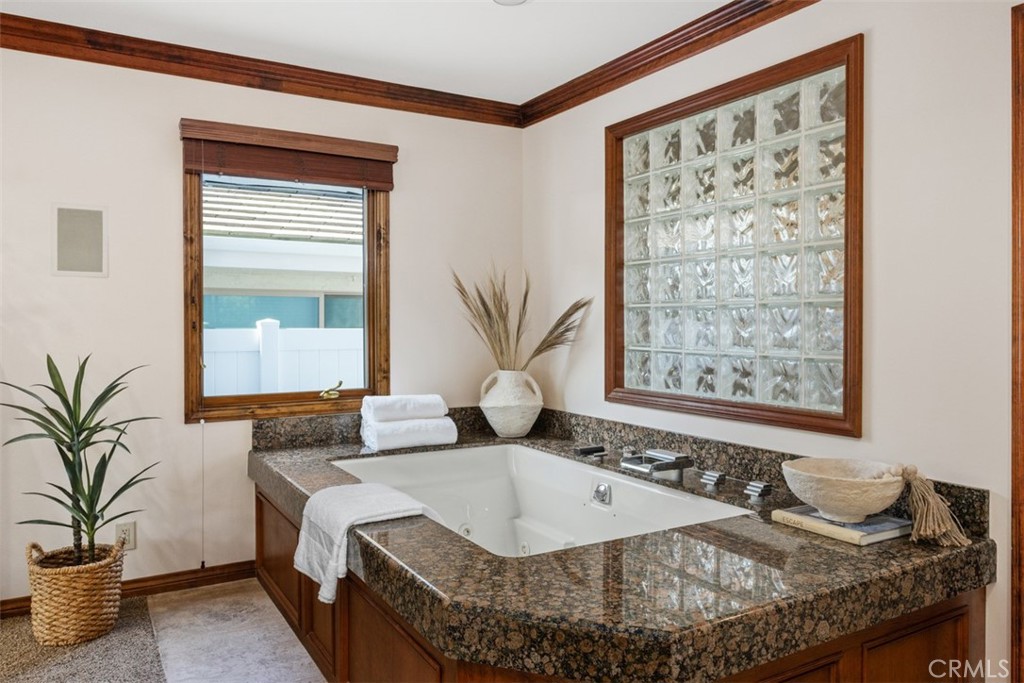 6421 East Bixby Hill Road Long Beach, CA 90815 - Photo 21 of 35 a bath tub sitting in a bathroom next to a window