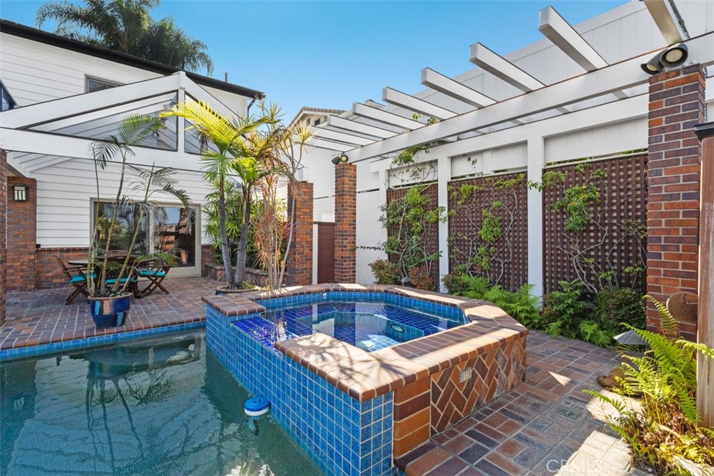 6421 East Bixby Hill Road Long Beach, CA 90815 - Photo 32 of 35 a view of outdoor space with swimming pool and furniture