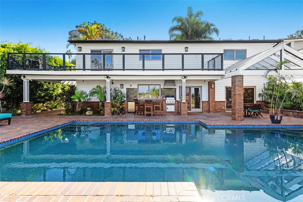 6421 East Bixby Hill Road Long Beach, CA 90815 - Photo 34 of 35 a swimming pool view with a garden space