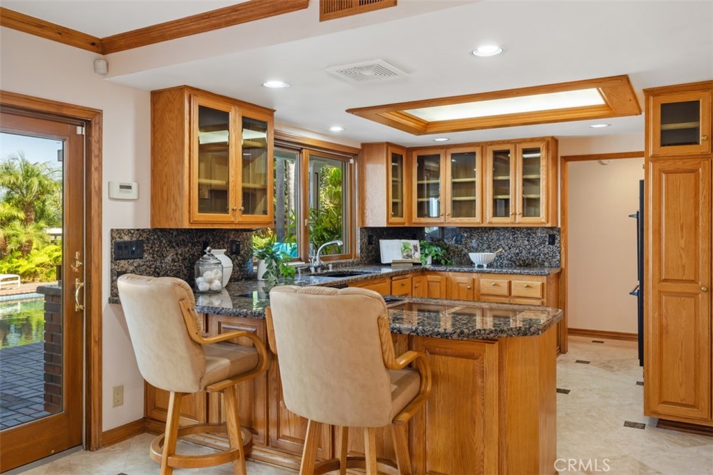 6421 East Bixby Hill Road Long Beach, CA 90815 - Photo 10 of 35 a living room with furniture and a large window