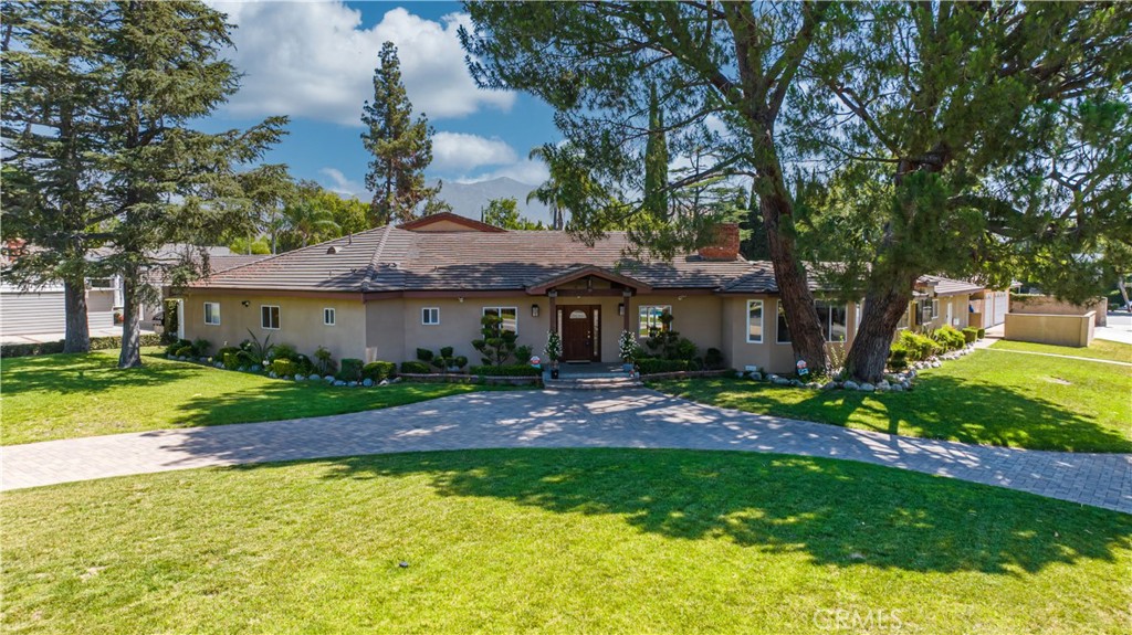 a front view of a house with a yard and porch