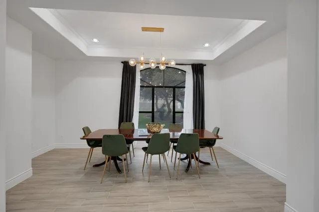 a work room with furniture and a flat screen tv