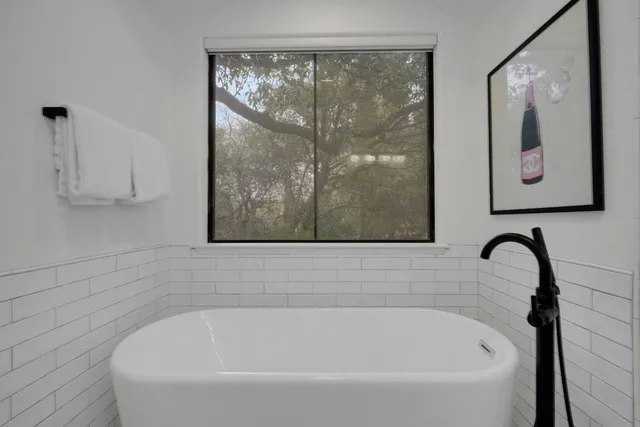 a bathroom with a double vanity sink a mirror and shower