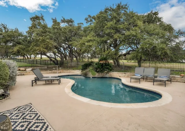 a living room with kitchen island furniture and a potted plant