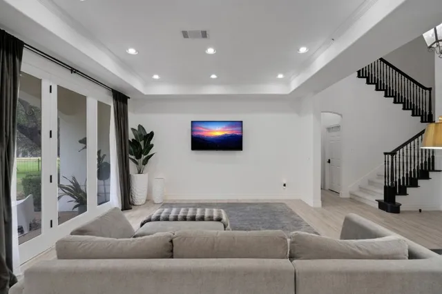 a kitchen with stainless steel appliances a stove a refrigerator sink and cabinets