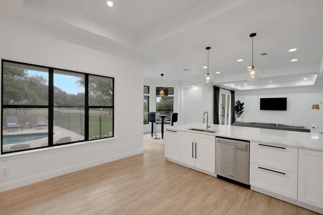 a dining room with furniture and wooden floor