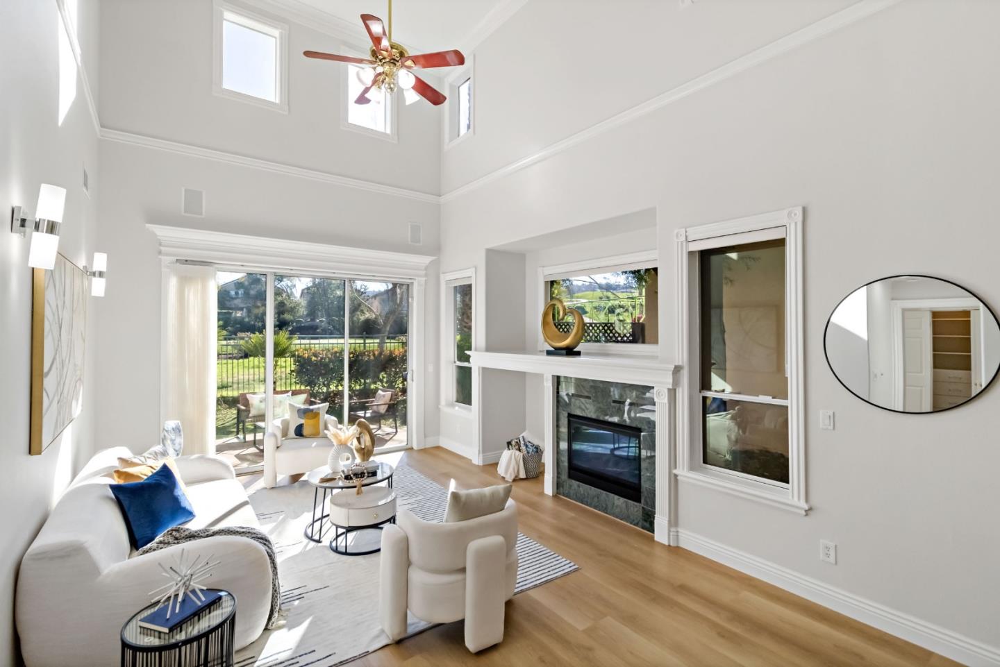5335 Roxburghe Court San Jose, CA 95138 - Photo 11 of 60 a living room with fireplace furniture and a wooden floor