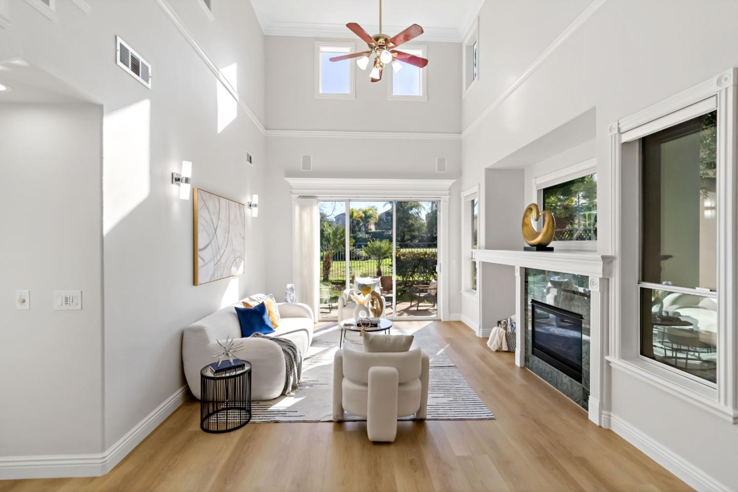 5335 Roxburghe Court San Jose, CA 95138 - Photo 15 of 60 a living room with fireplace furniture and a large window