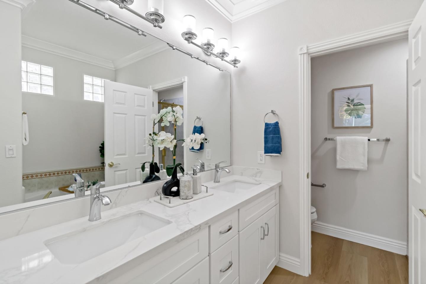 5335 Roxburghe Court San Jose, CA 95138 - Photo 34 of 60 a bathroom with a sink double vanity granite and a mirror