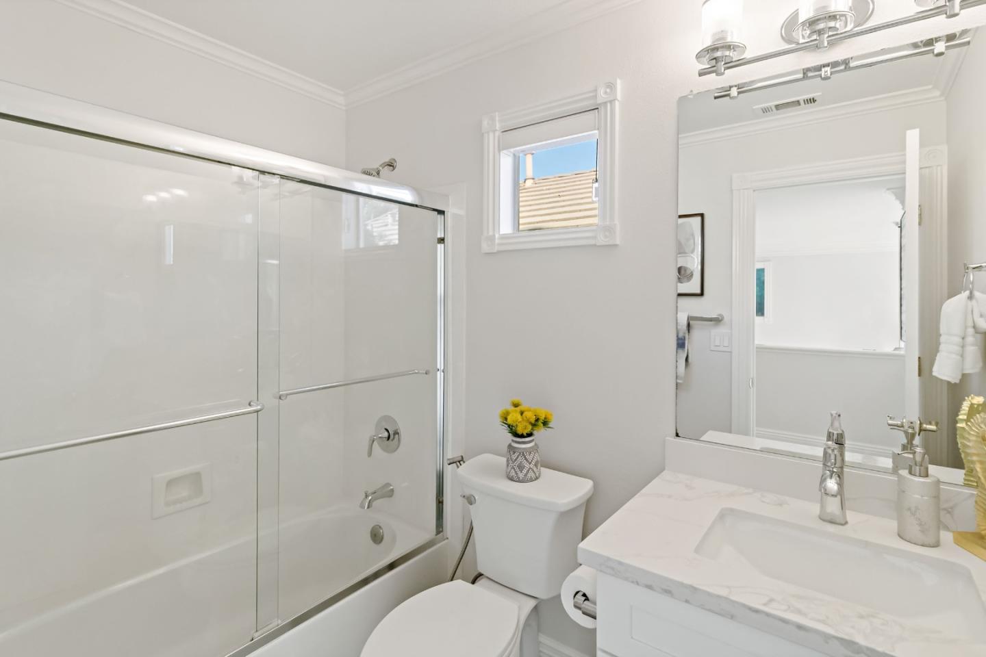 5335 Roxburghe Court San Jose, CA 95138 - Photo 40 of 60 a bathroom with a sink mirror vanity and toilet