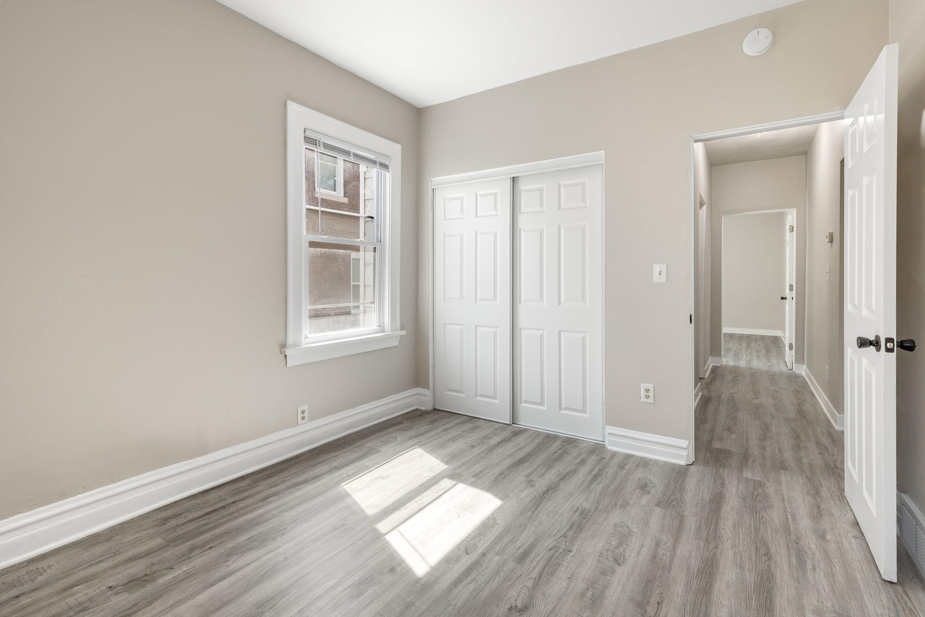 4343 Adams Street Gary, IN 46408 - Photo 12 of 15 wooden floor in an empty room with a window