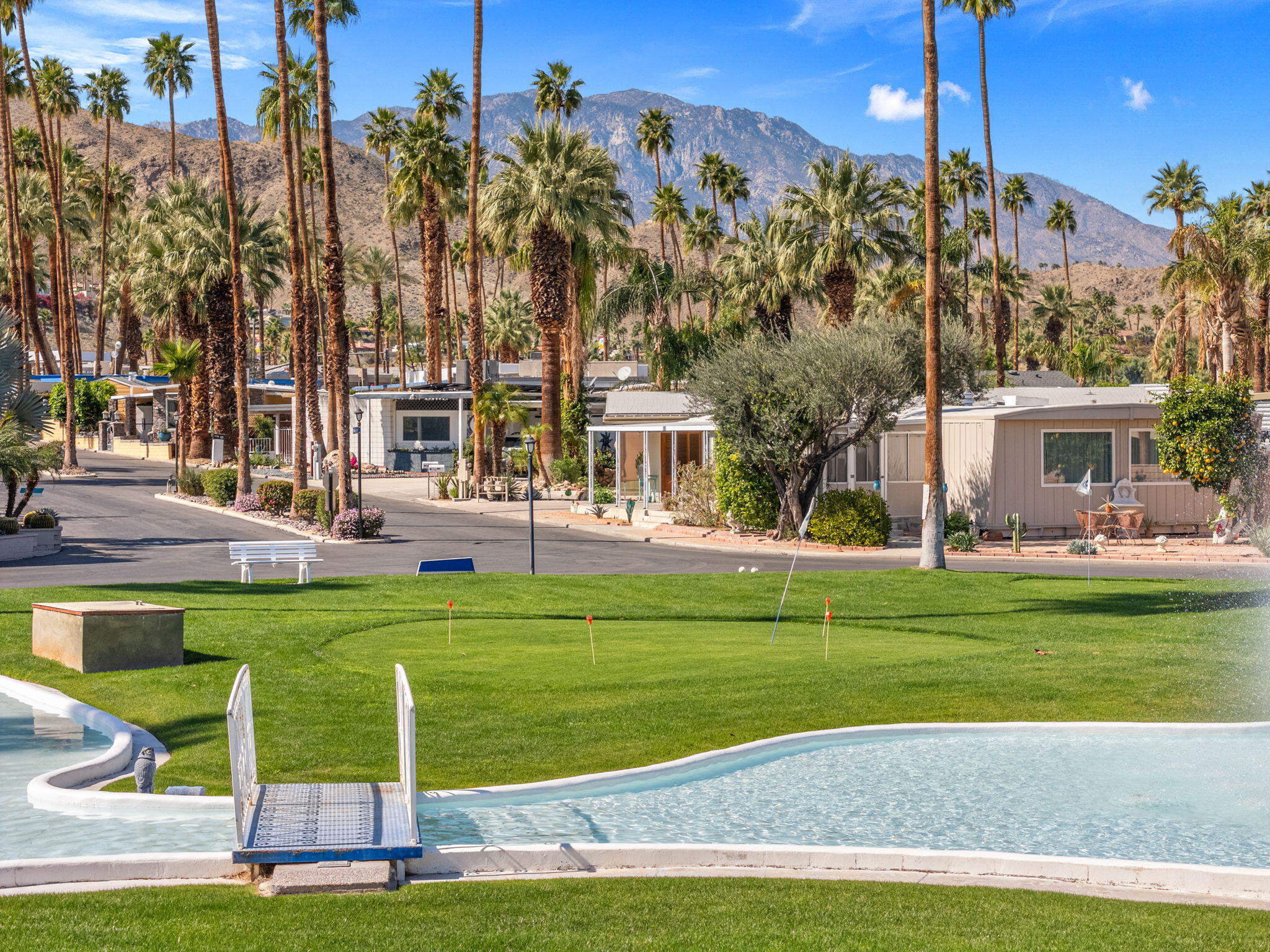 70260 Highway 111, Unit 57 Rancho Mirage, CA 92270 - Photo 4 of 38 a view of a fountain in front of a house
