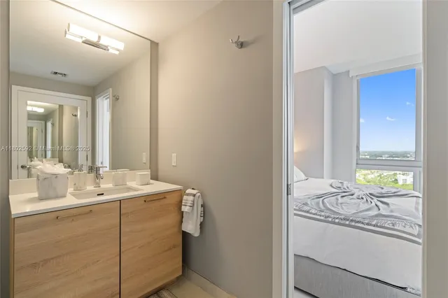 a bathroom with a sink and a mirror