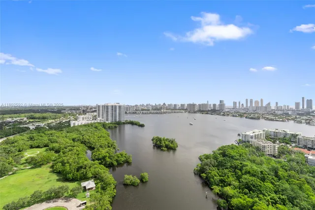a palm tree sitting in front of a building