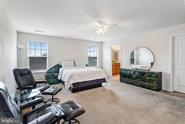 a bedroom with bed and window