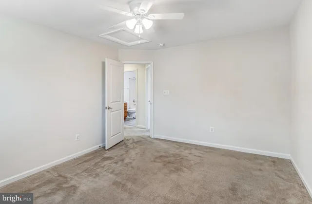 an empty room with a view of a bathroom
