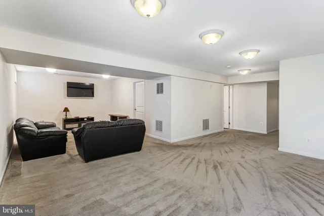 a living room with a couch and a flat screen tv