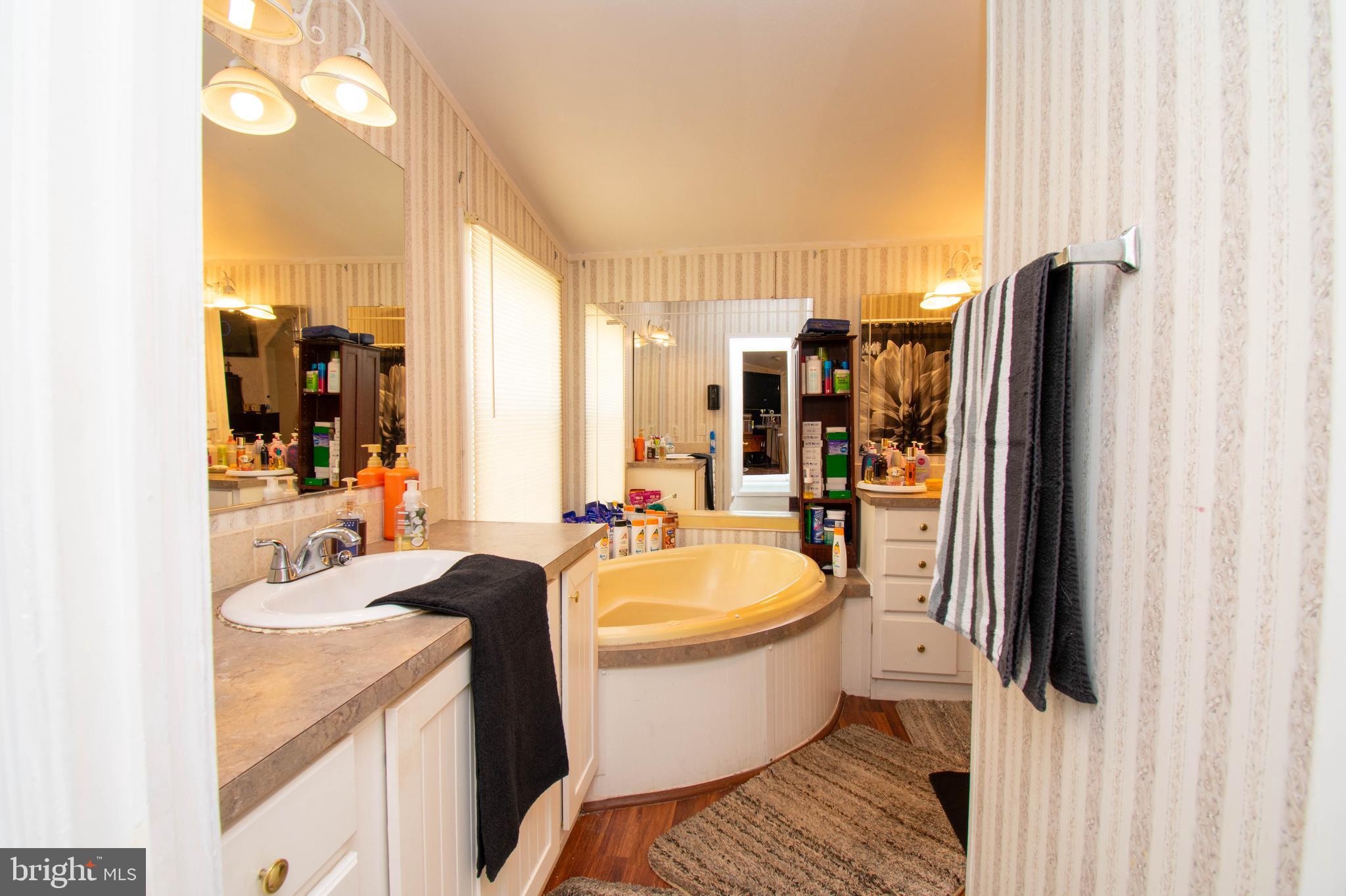 8791 Menokin Road Montross, VA 22520 - Photo 26 of 37 a bathroom with a sink toilet and shower