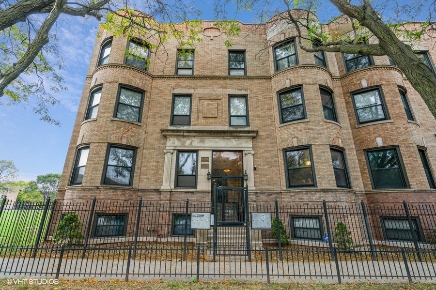 a view of a brick building with many windows