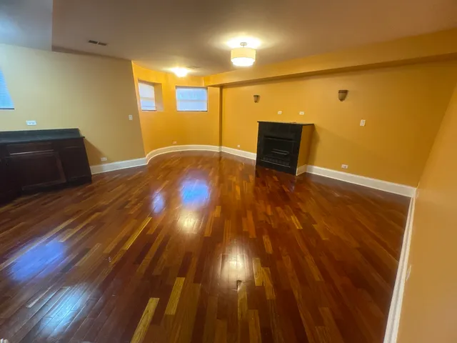 a view of room with wooden floor