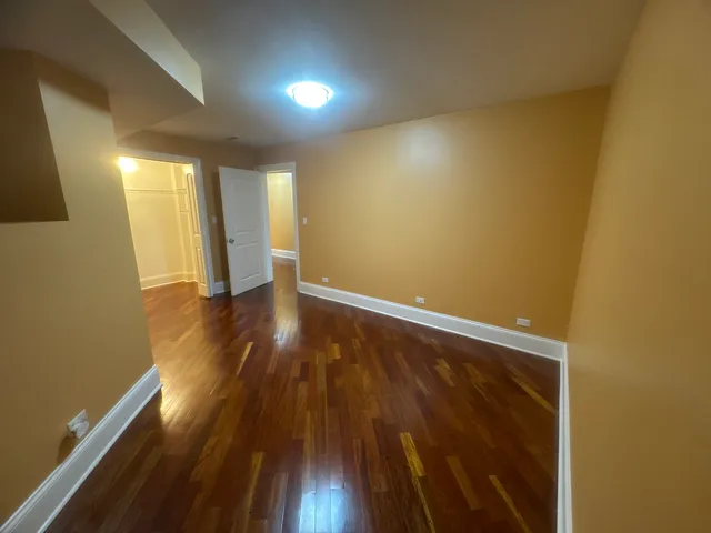 wooden floor in a hall with an entryway