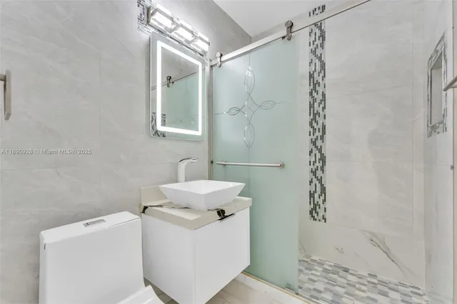 a bedroom with a bed and a potted plant