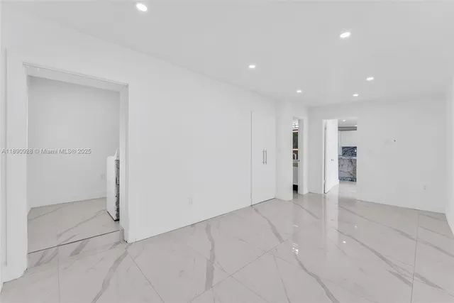 a view of empty room with windows