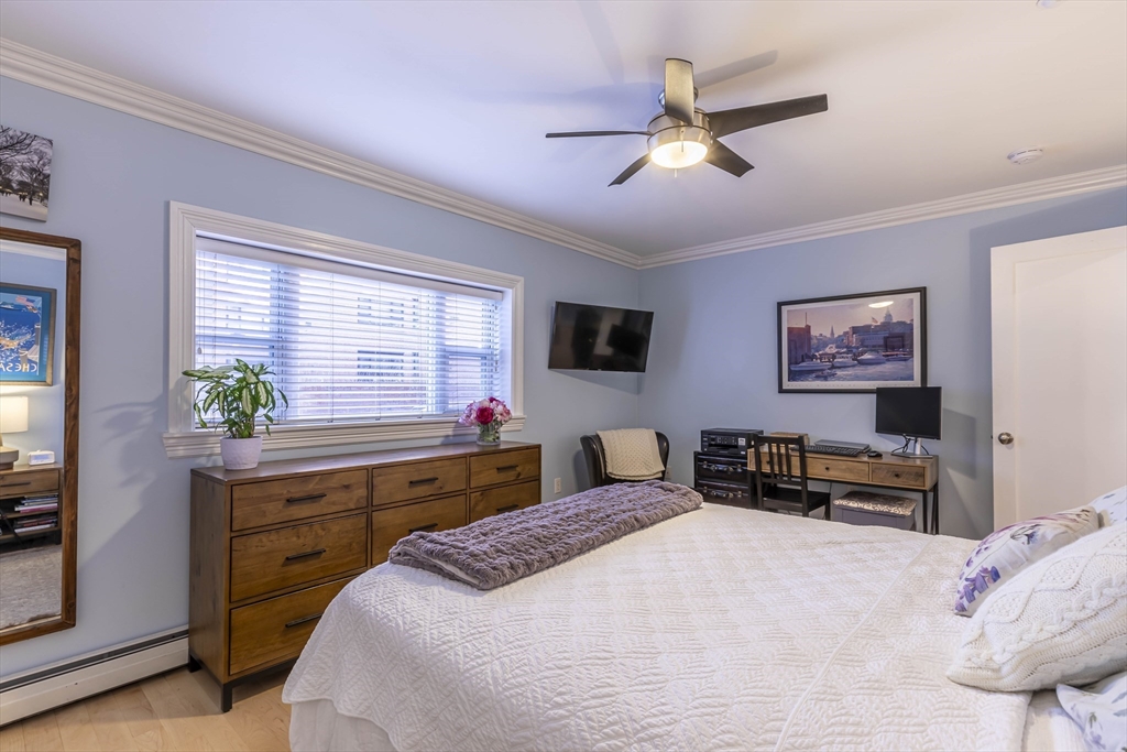 52 Cooper Street, Unit 2 Boston, MA 02113 - Photo 11 of 15 a bedroom with a bed and a desk