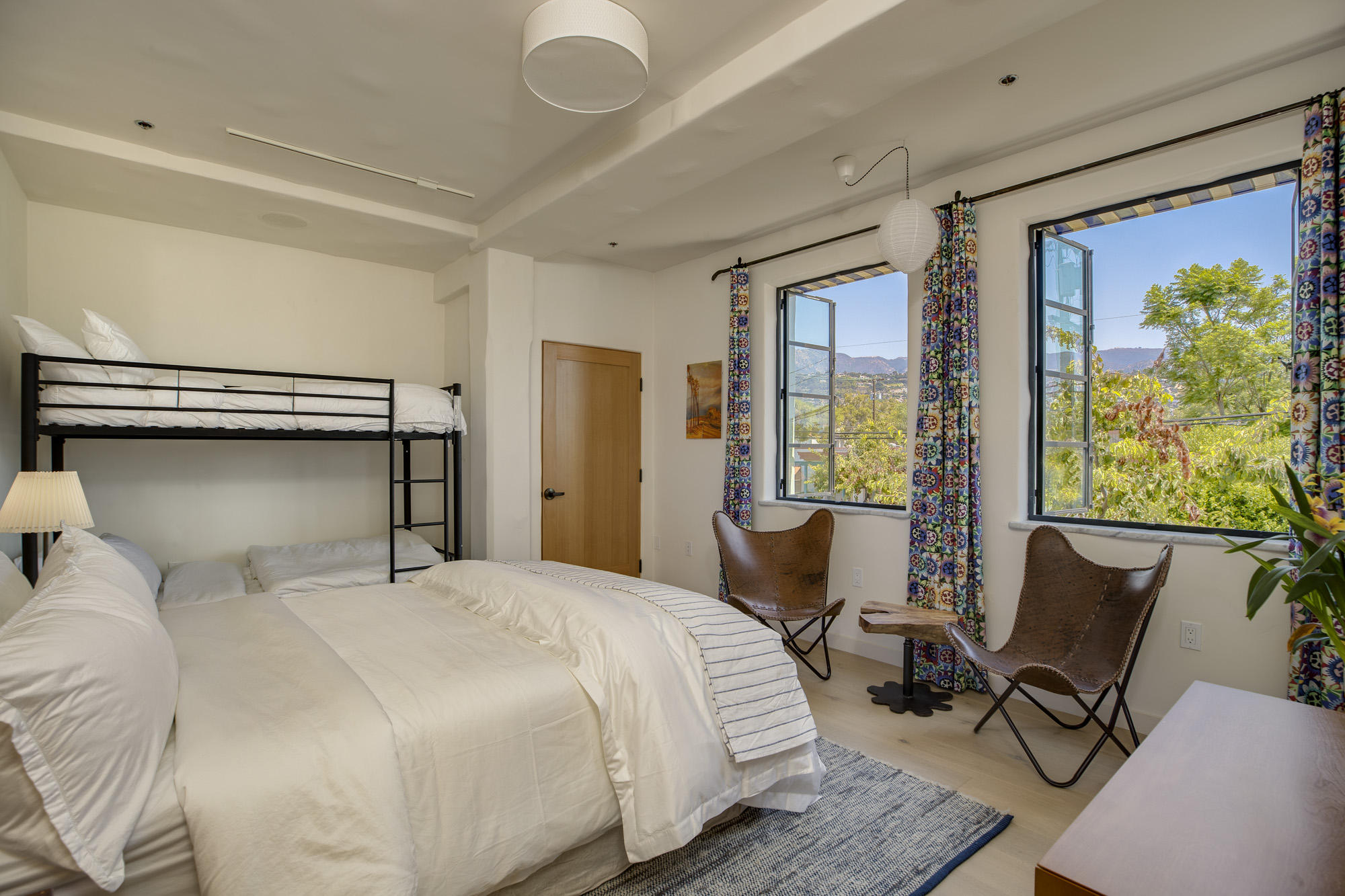 819 Garden Street Santa Barbara, CA 93101 - Photo 13 of 41 a bedroom with a bed a chair and next to a window