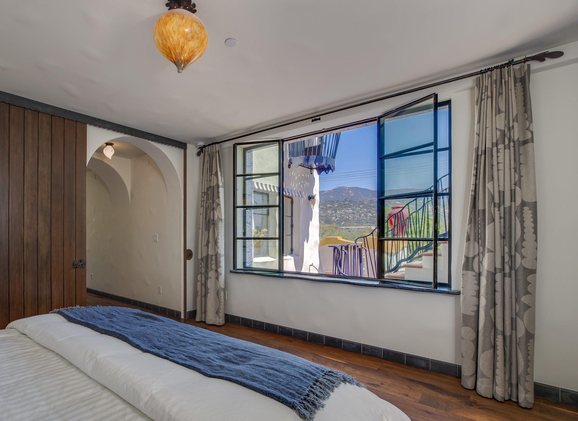 819 Garden Street Santa Barbara, CA 93101 - Photo 18 of 41 a bedroom with a bed and a window