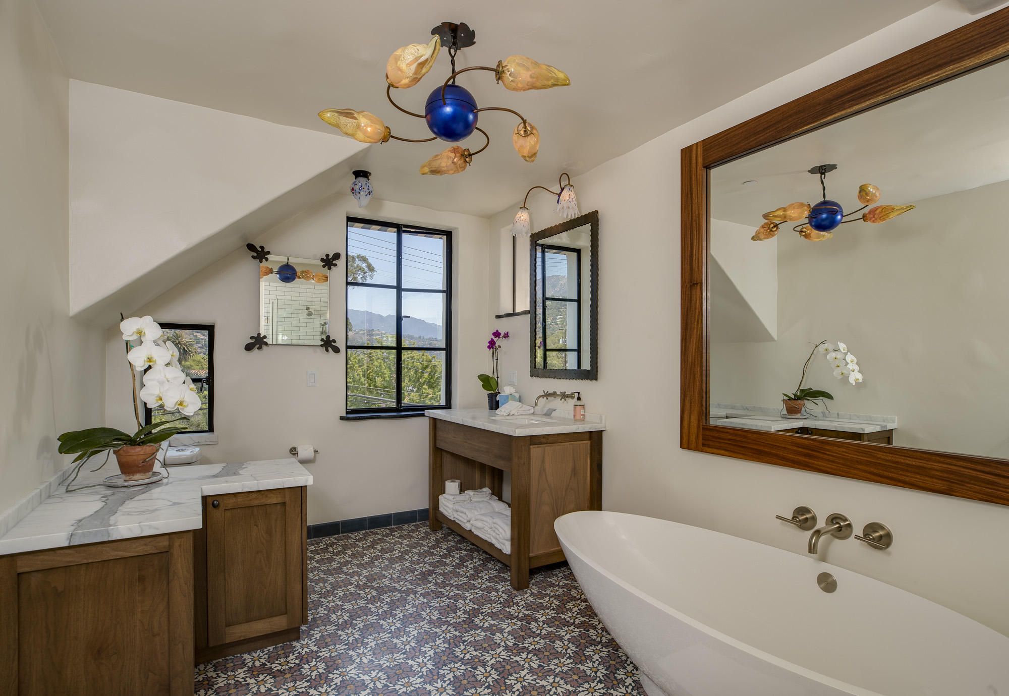 819 Garden Street Santa Barbara, CA 93101 - Photo 19 of 41 a bathroom with a sink and mirror with bathtub