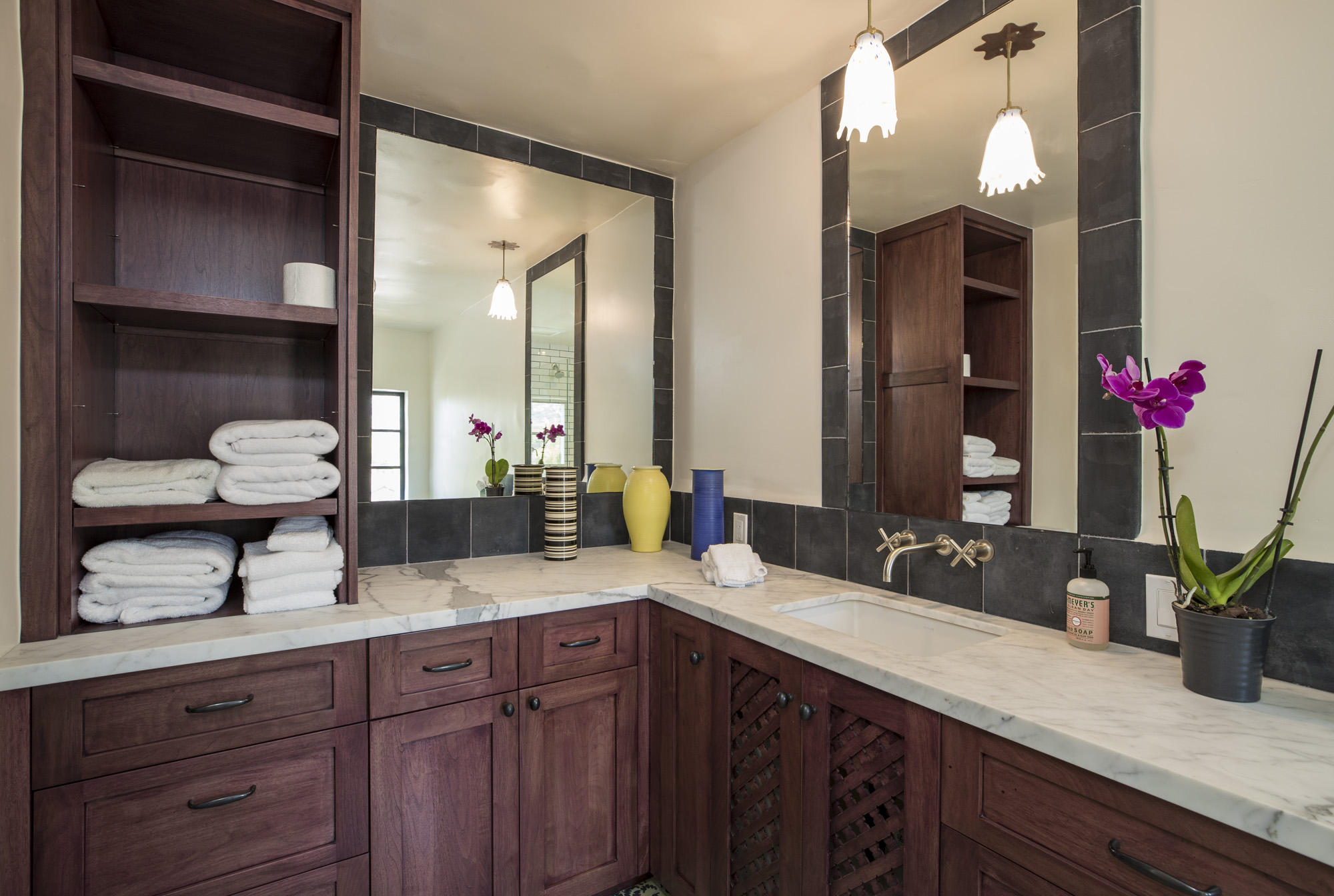 819 Garden Street Santa Barbara, CA 93101 - Photo 21 of 41 a bathroom with a granite countertop sink and a mirror