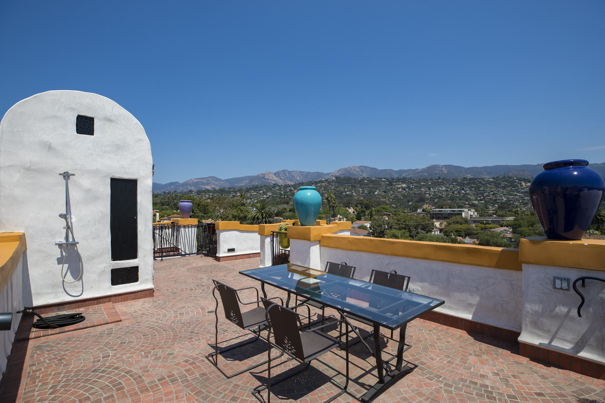 819 Garden Street Santa Barbara, CA 93101 - Photo 37 of 41 a view of a chairs and table in the terrace