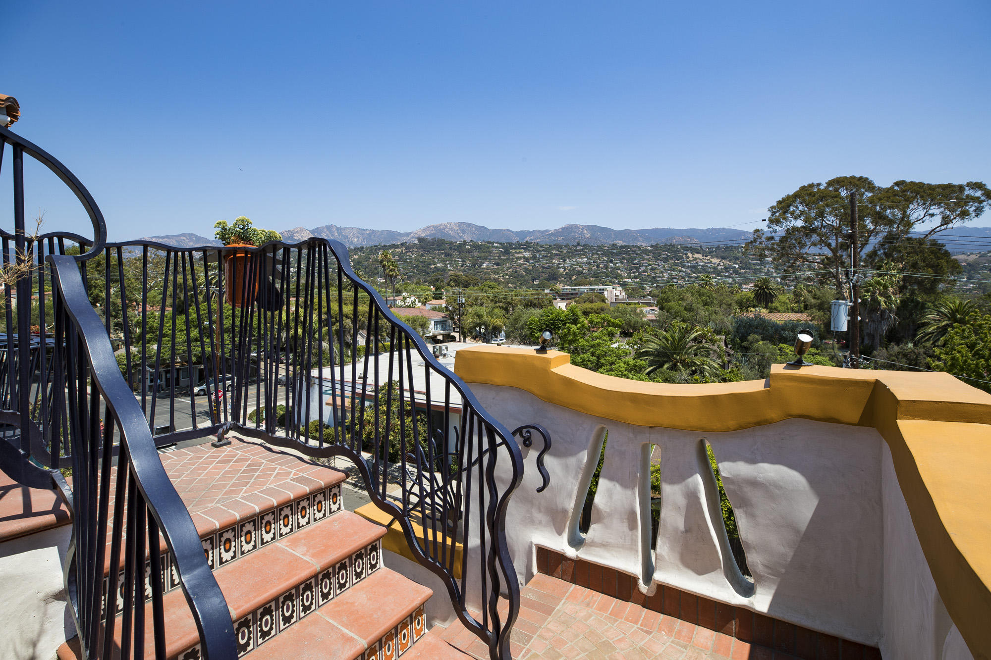819 Garden Street Santa Barbara, CA 93101 - Photo 7 of 41 a view of a balcony with mountain view and wooden floor