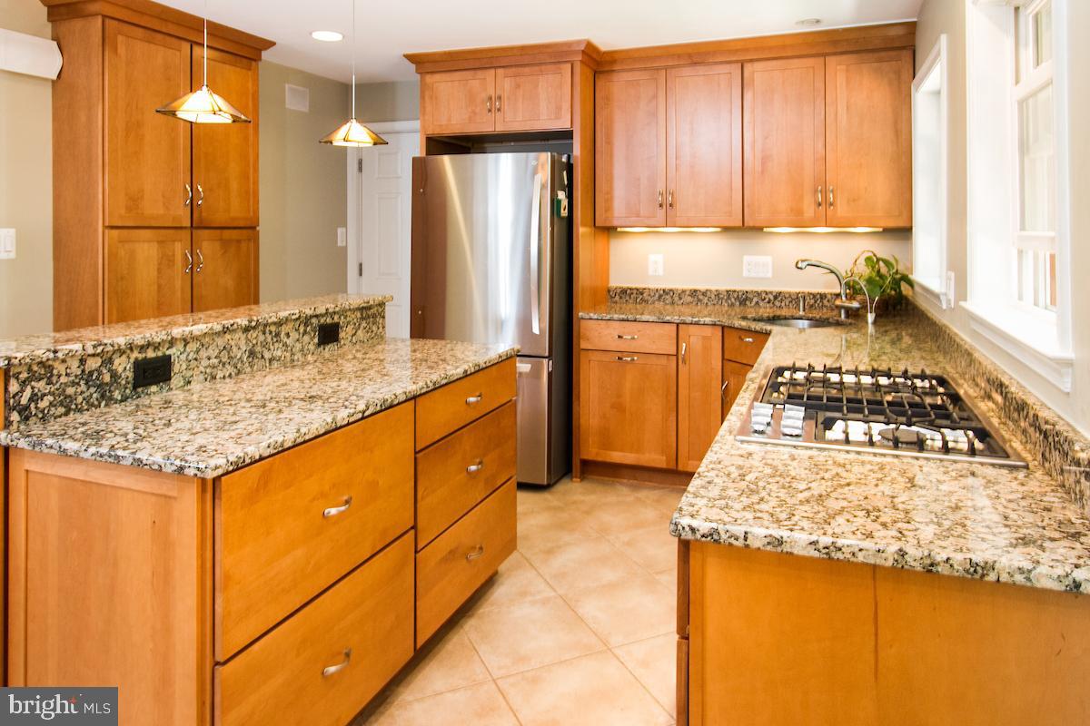 7102 Hadlow Court Springfield, VA 22152 - Photo 11 of 38 Custom premium cabinets and granite countertops.