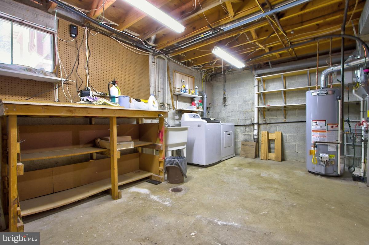 7102 Hadlow Court Springfield, VA 22152 - Photo 22 of 38 Utility Room with a Work Bench