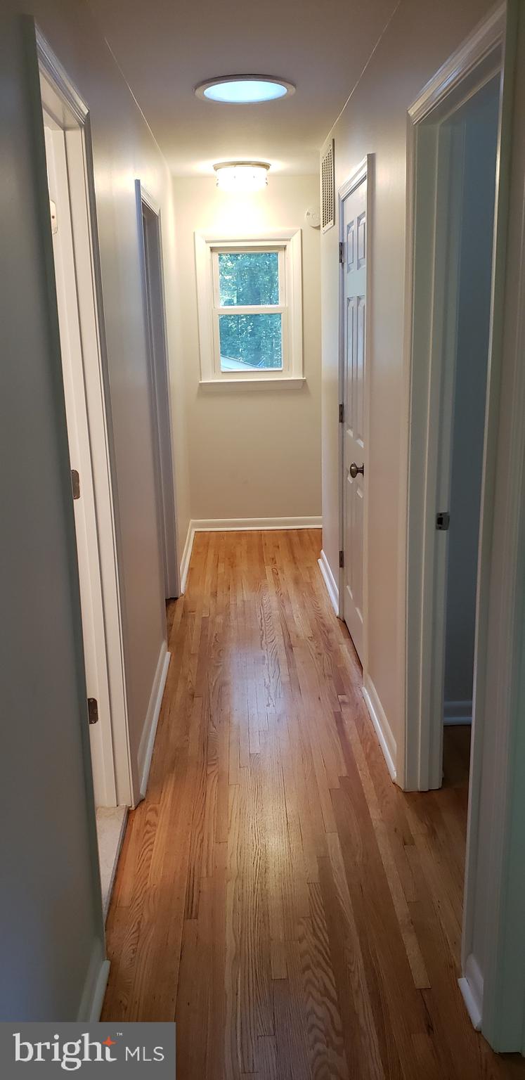 7102 Hadlow Court Springfield, VA 22152 - Photo 24 of 38 Solar tube brightens the hallway.