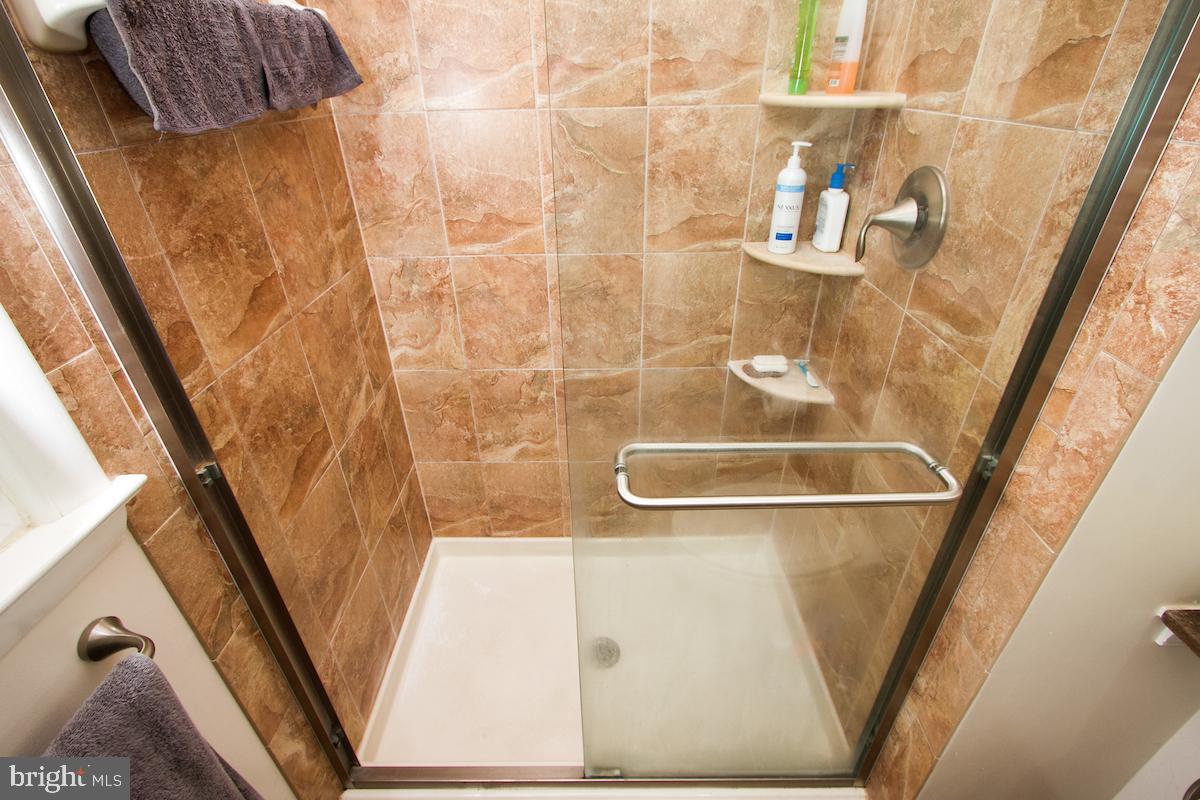 7102 Hadlow Court Springfield, VA 22152 - Photo 28 of 38 Custom tiled shower