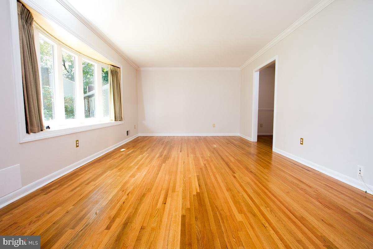7102 Hadlow Court Springfield, VA 22152 - Photo 4 of 38 LR with hardwood floors and crown molding.