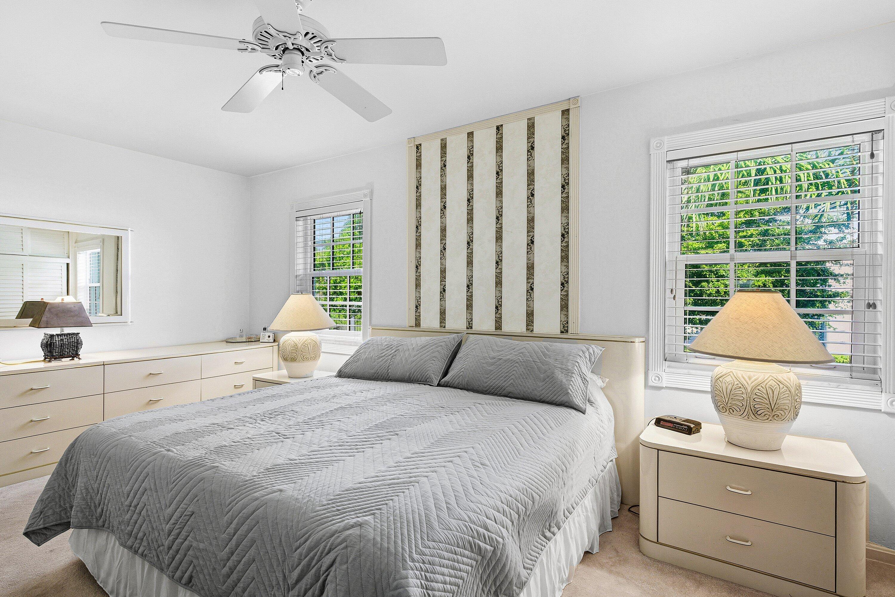 6590 North Ocean Boulevard, Unit 5 Ocean Ridge, FL 33435 - Photo 8 of 20 a bedroom with a bed and a couch