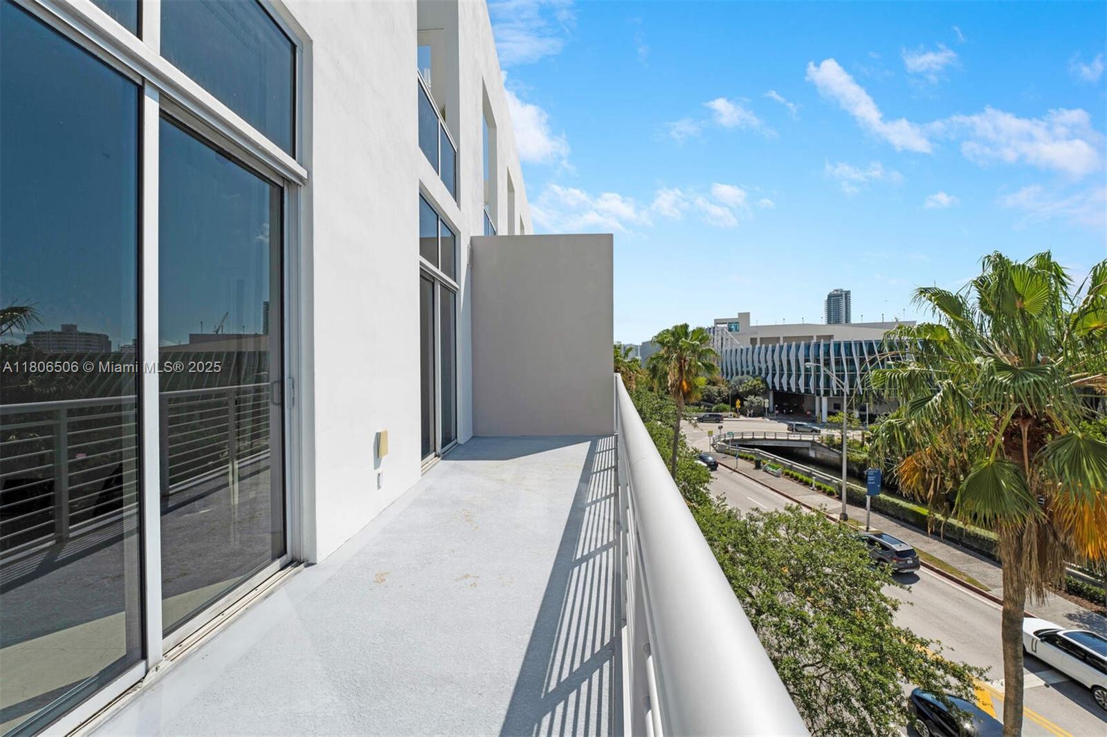 2001 Meridian Avenue, Unit 516 Miami Beach, FL 33139 - Photo 15 of 26 a balcony with view of car parked