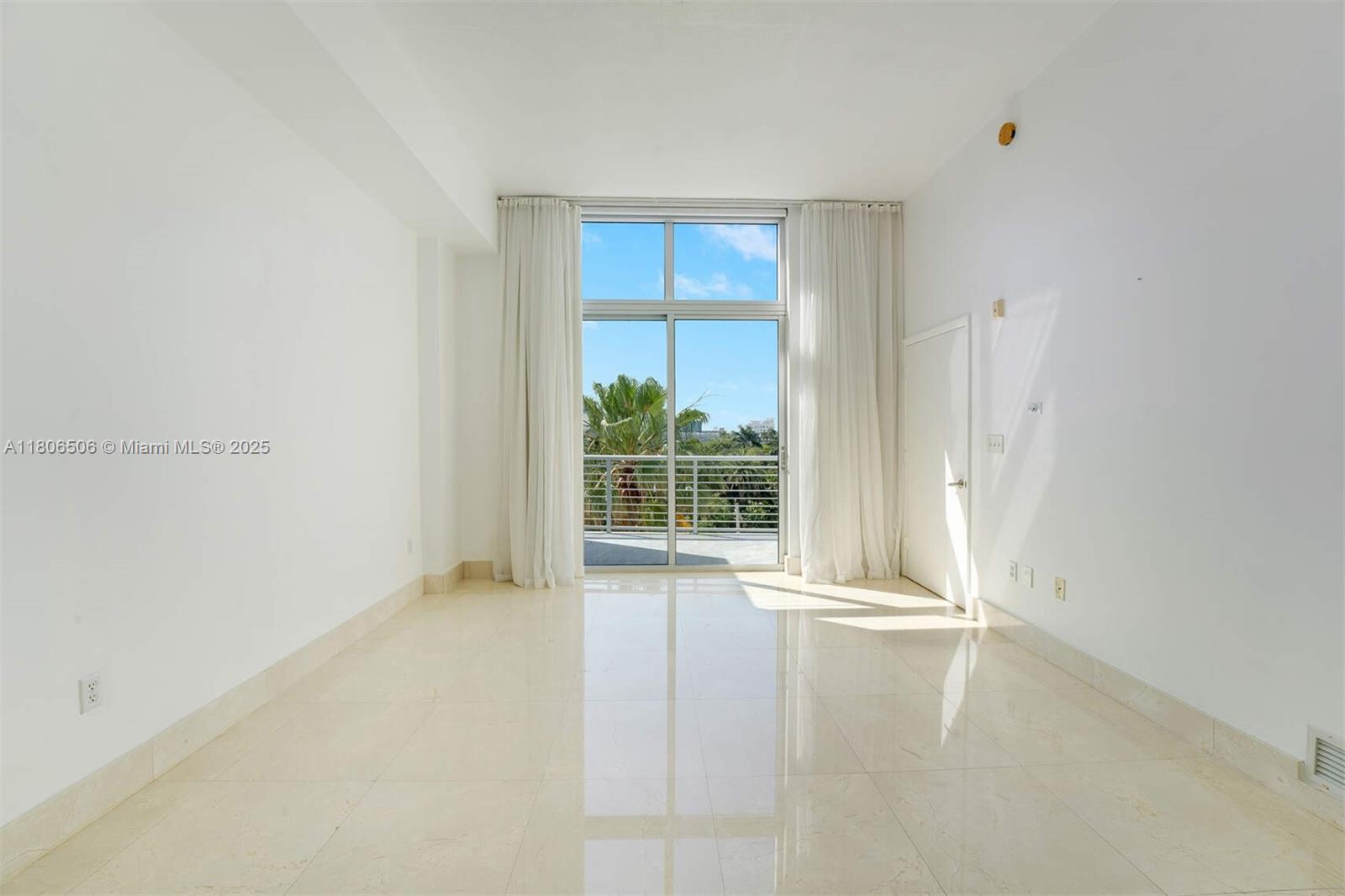 2001 Meridian Avenue, Unit 516 Miami Beach, FL 33139 - Photo 7 of 26 an empty room with windows