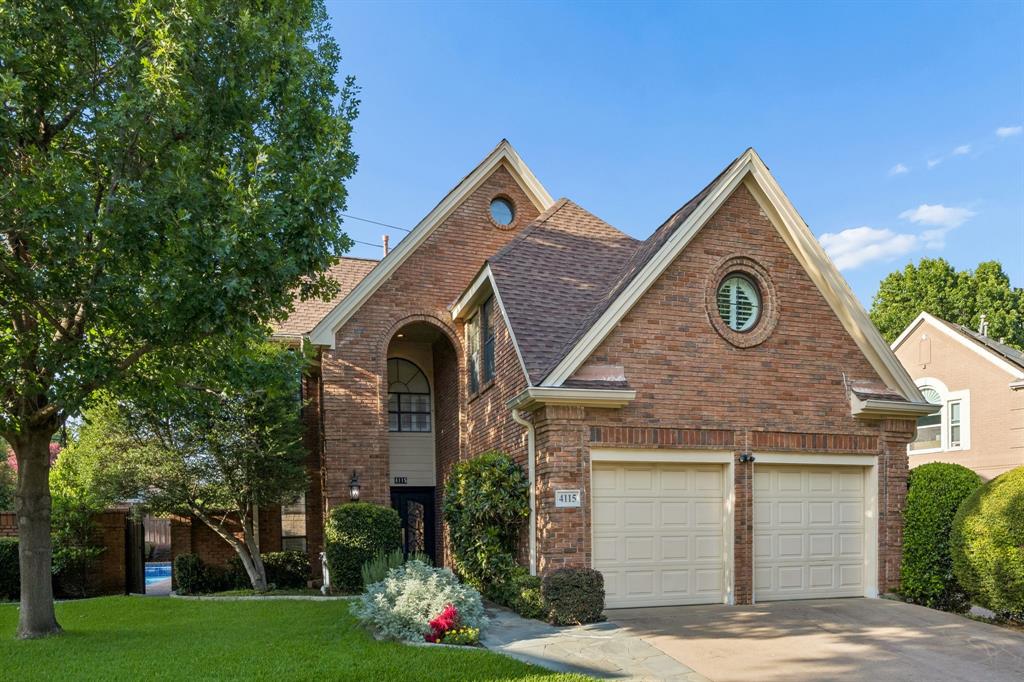 4115 Rive Lane Addison, TX 75001 - Photo 2 of 25 Brick exterior featuring a two-car garage, arched entry, and prominent gables
