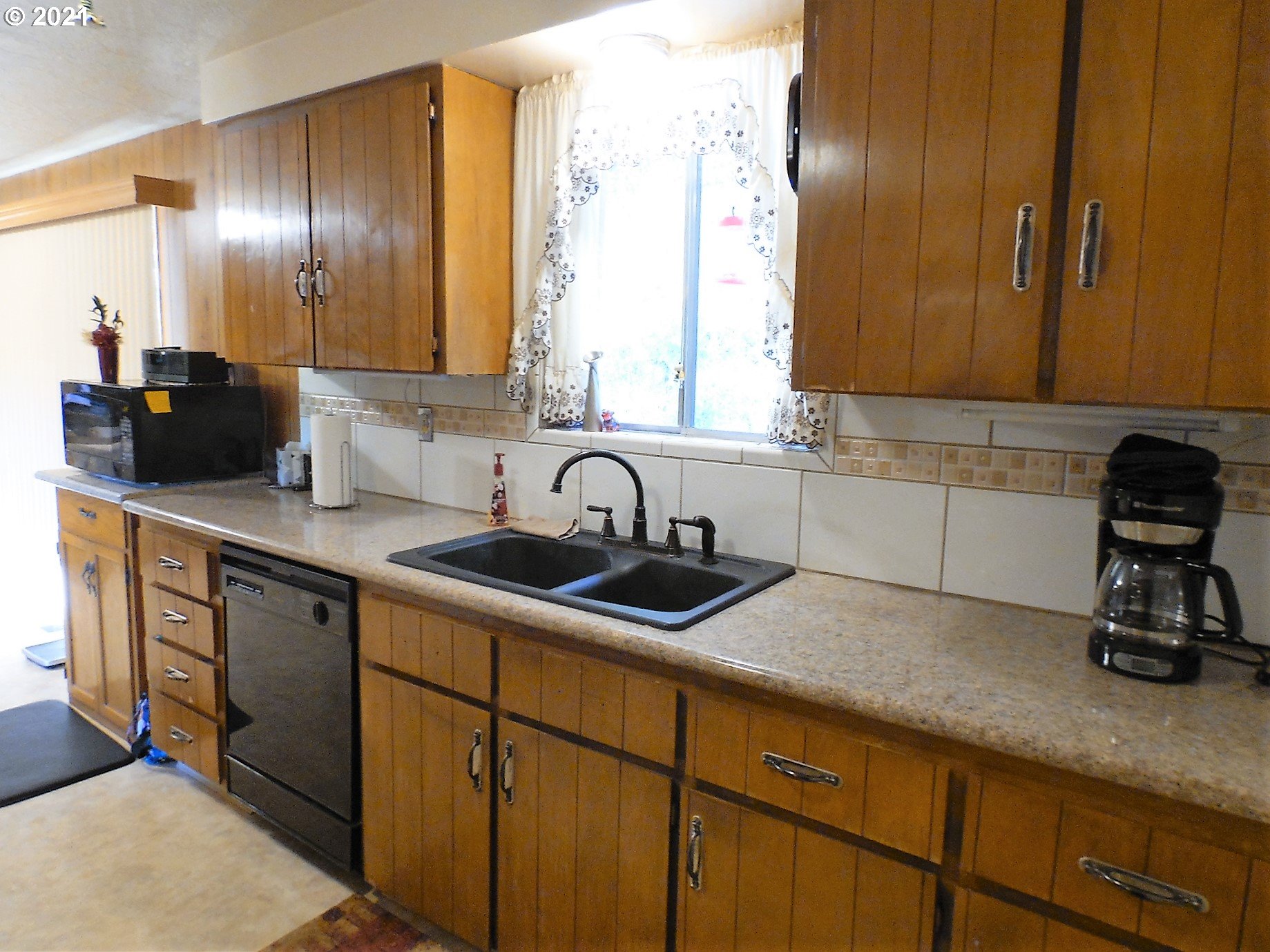 4235 Shoestring Road Riddle, OR 97469 - Photo 11 of 30 a kitchen with sink cabinets and window