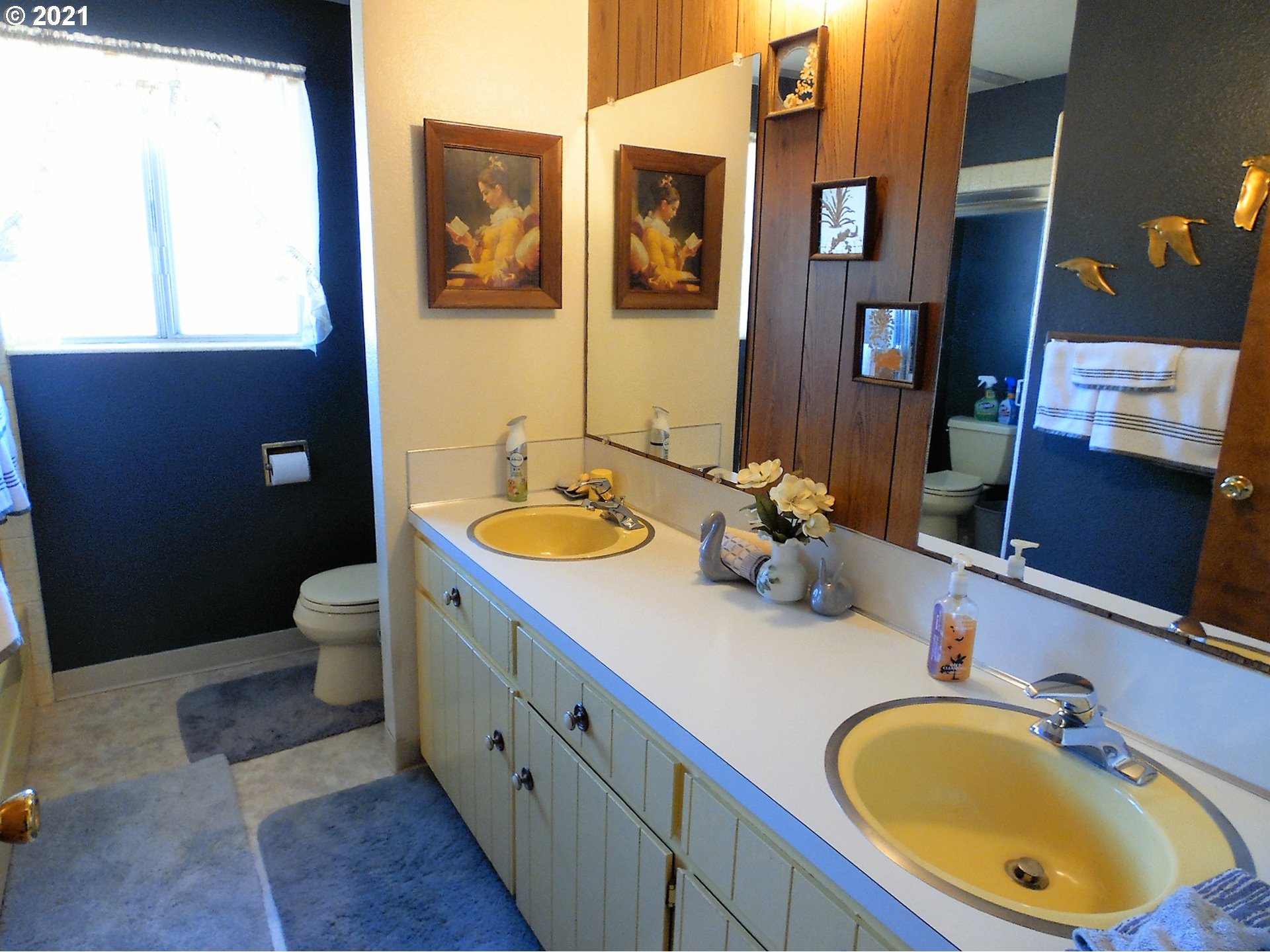 4235 Shoestring Road Riddle, OR 97469 - Photo 14 of 30 a bathroom with a double vanity sink and a mirror