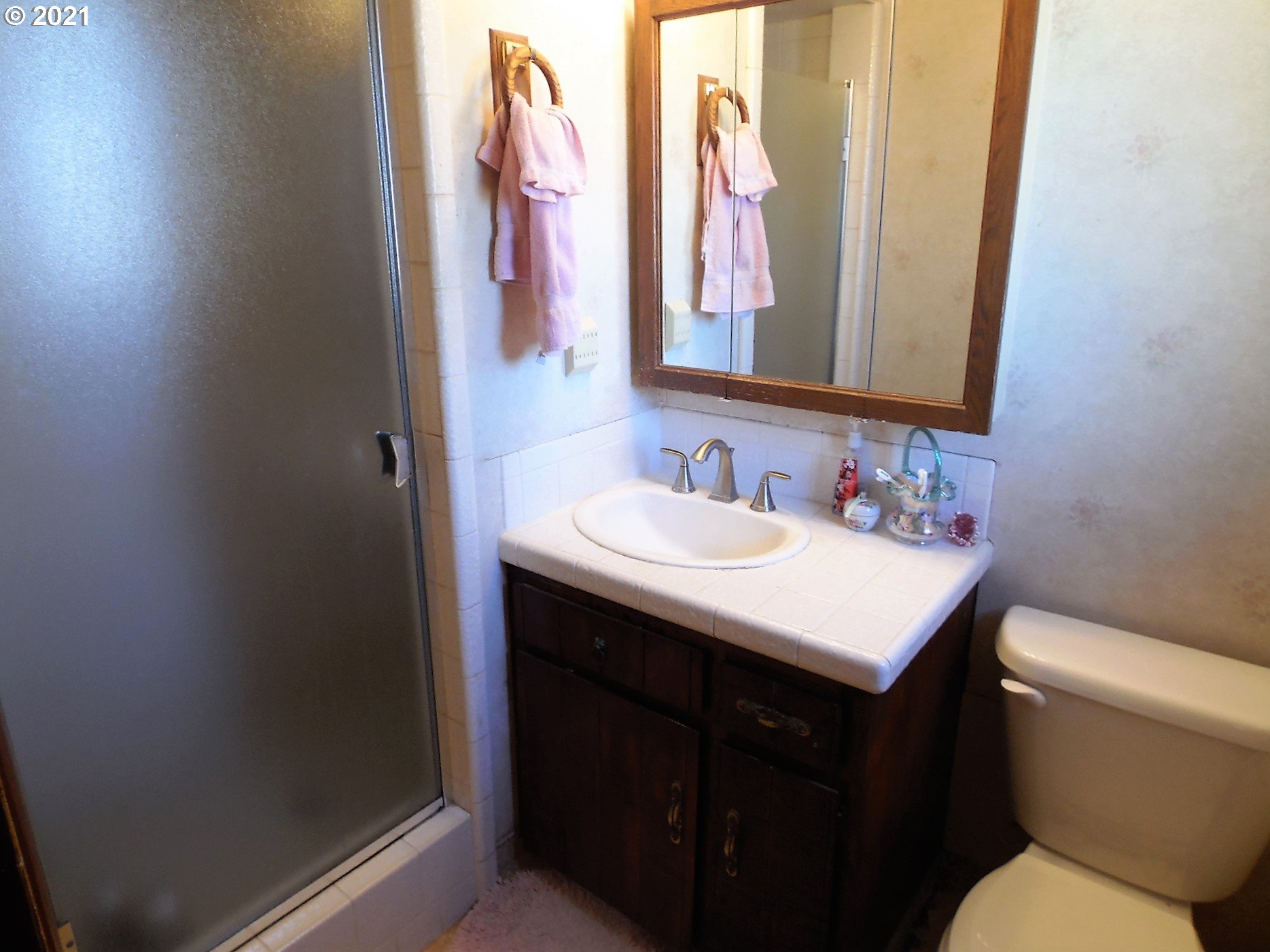 4235 Shoestring Road Riddle, OR 97469 - Photo 17 of 30 a bathroom with a sink and a mirror