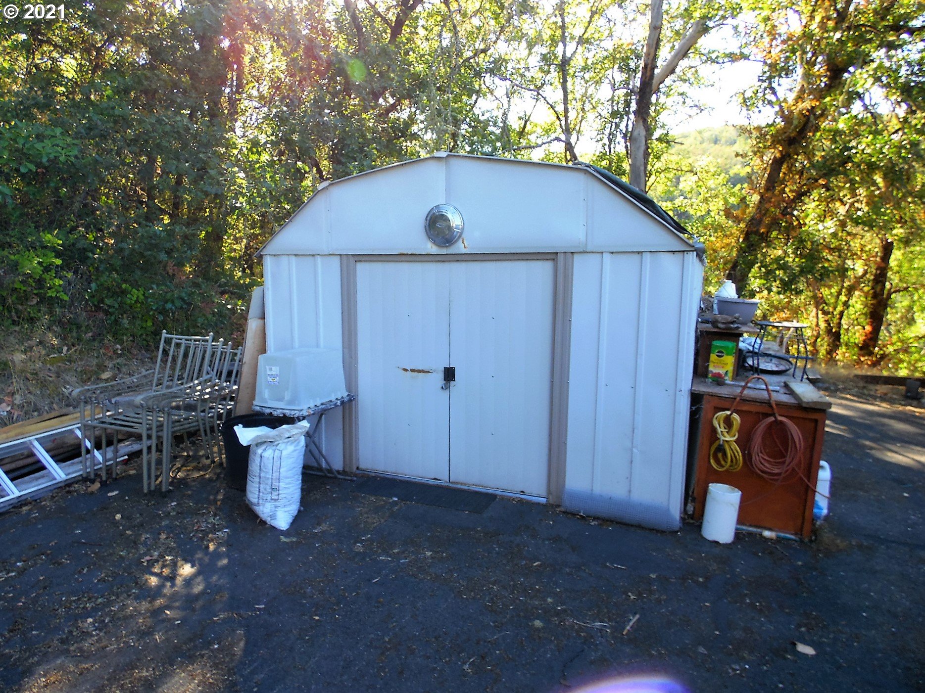 4235 Shoestring Road Riddle, OR 97469 - Photo 27 of 30 a backyard of a house with table and chairs
