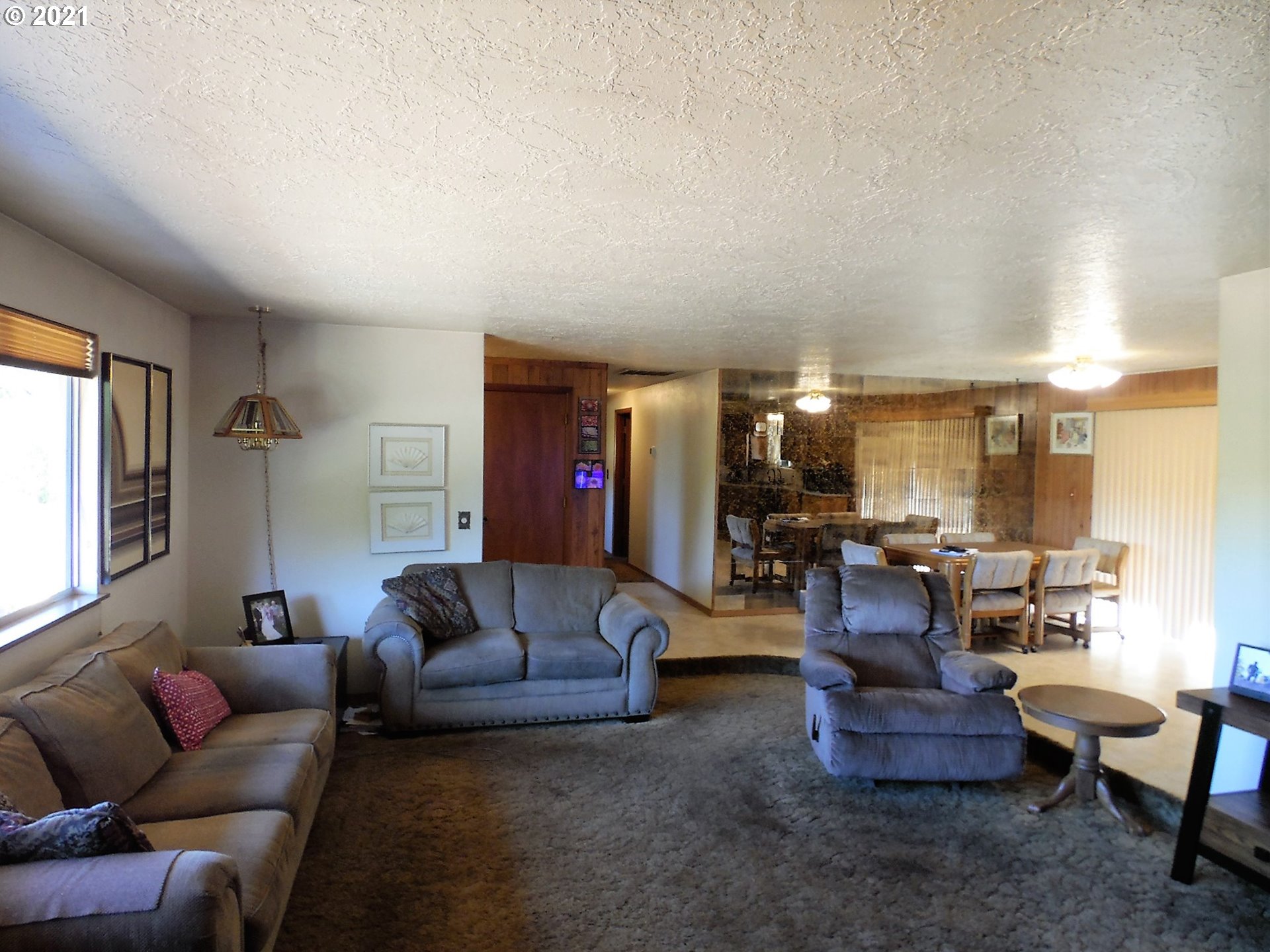4235 Shoestring Road Riddle, OR 97469 - Photo 6 of 30 a living room with furniture and a large window