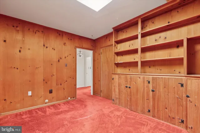 a view of a room with wooden walls