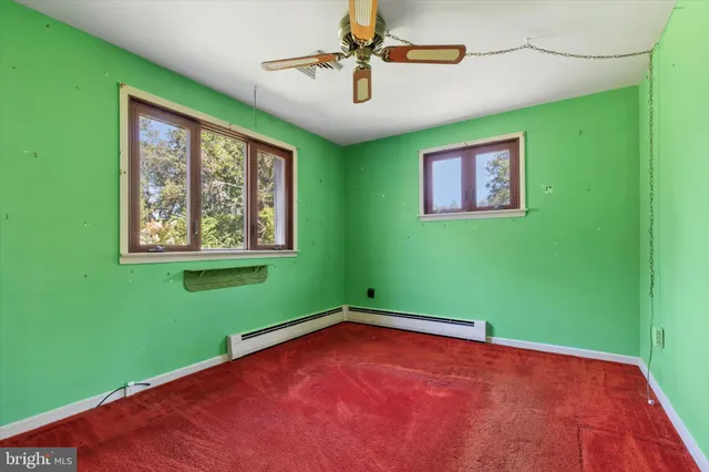 a view of a room with window and fan